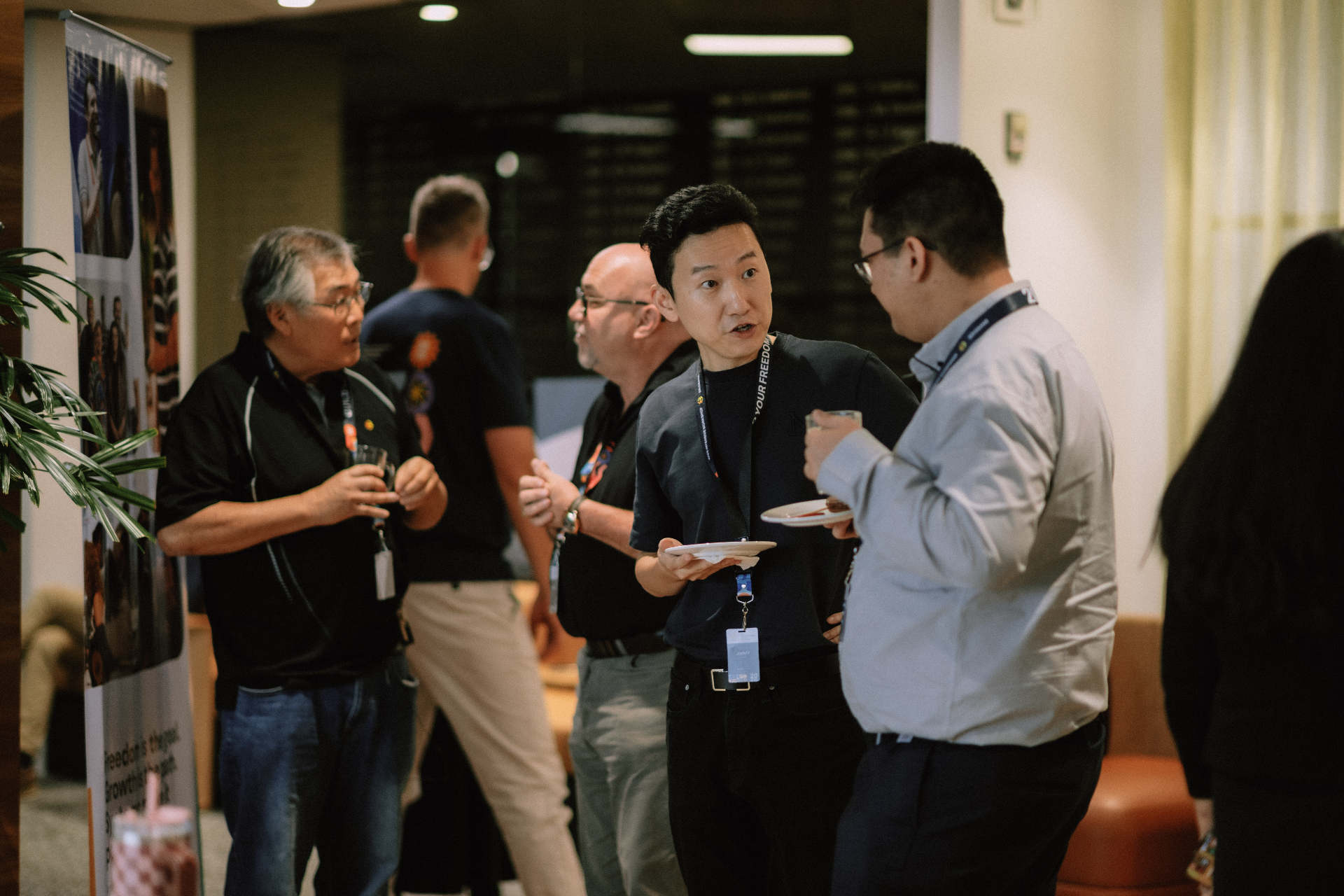 Attendees chatting with refreshments during the workshop event