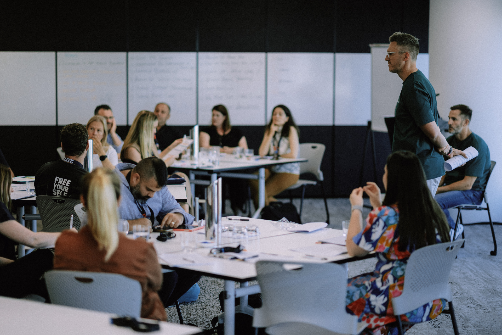 Firm owners planning at a whiteboard during a professional workshop
