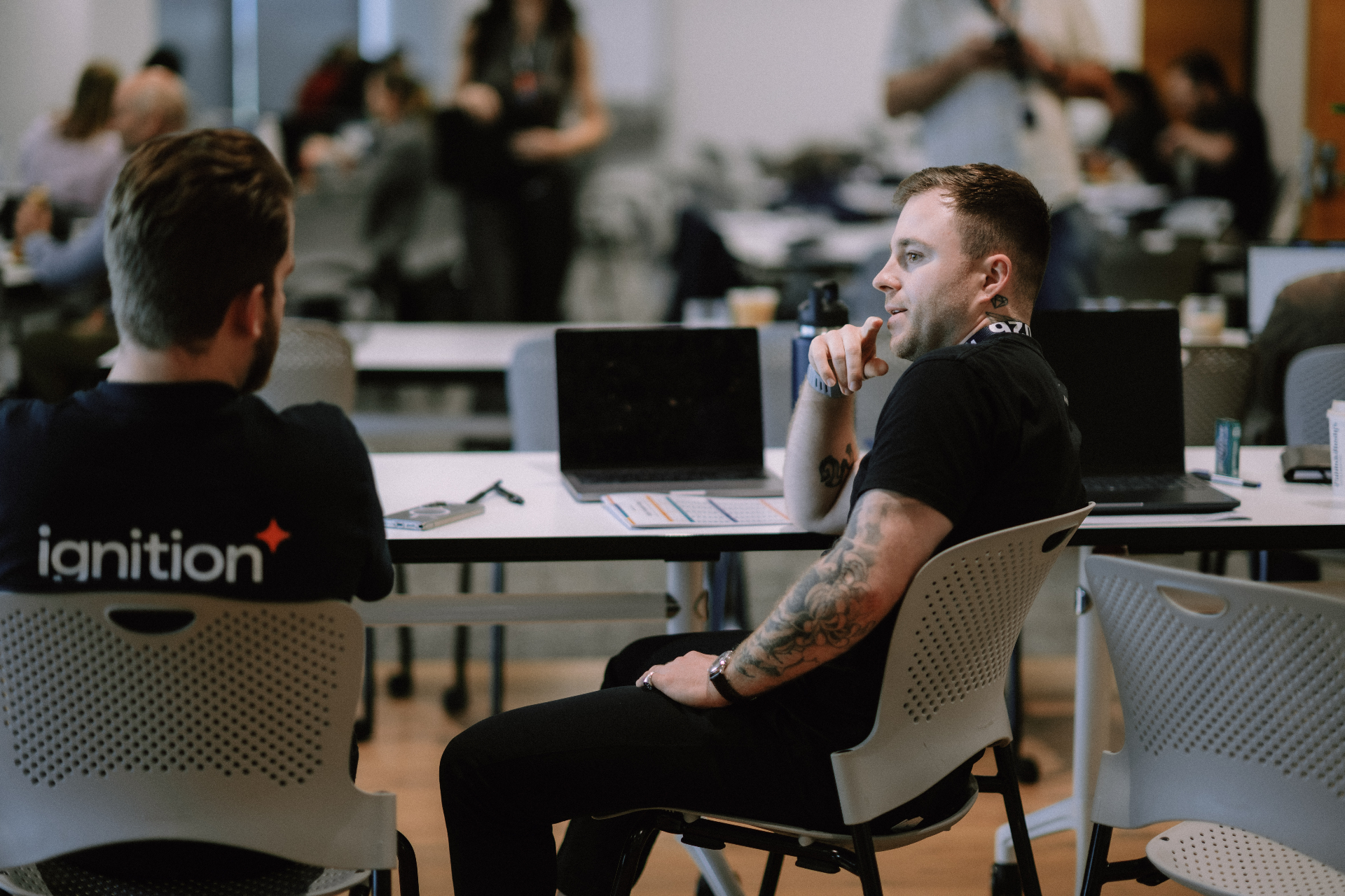 Two attendees seated in discussion during the May 25 Day 1 workshop