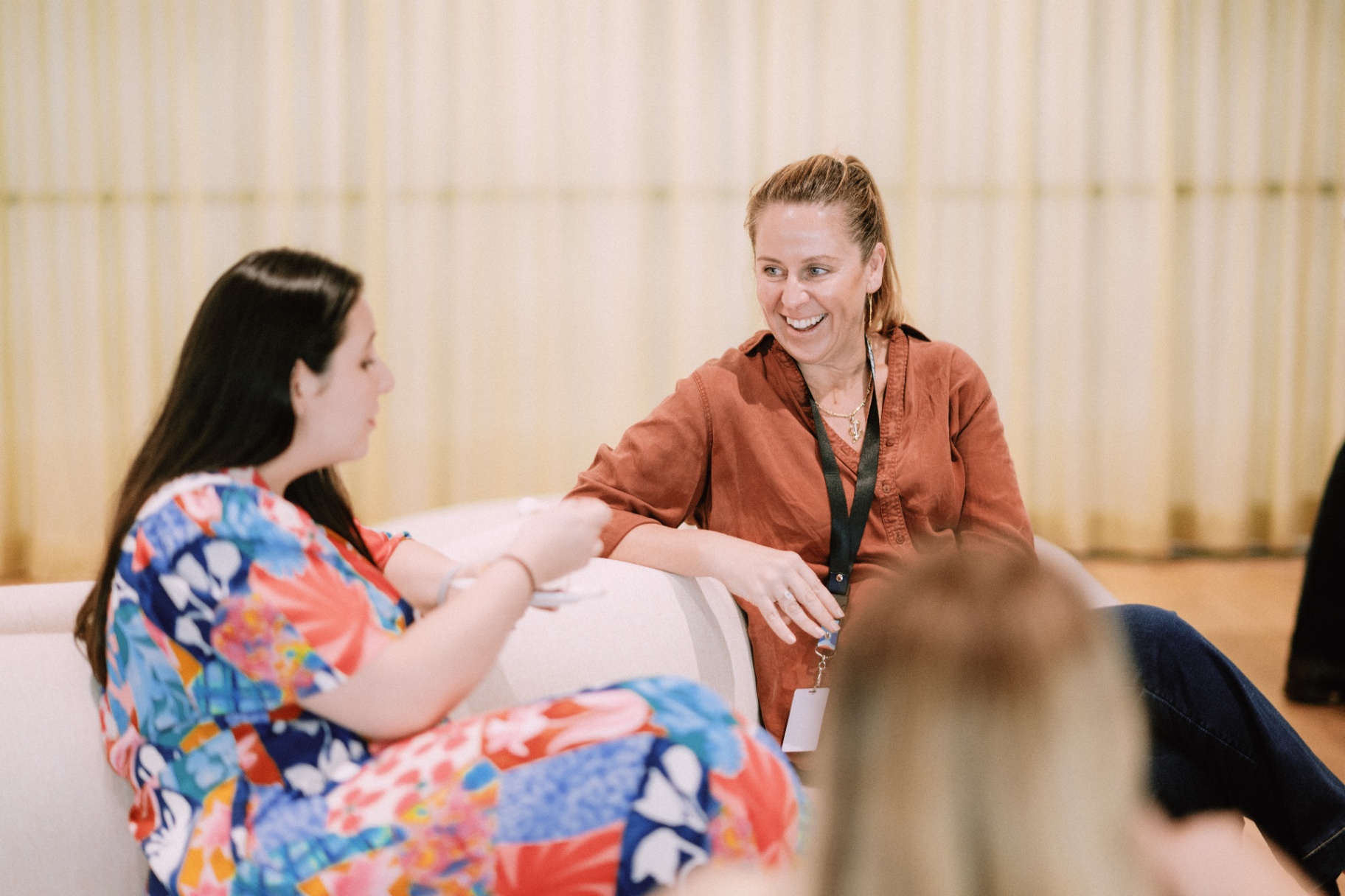 WizeAdvisory members in conversation during a workshop break