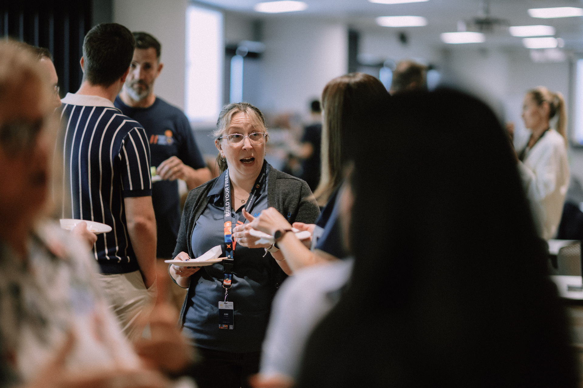 Attendees chatting during the May 25 Day 1 networking break