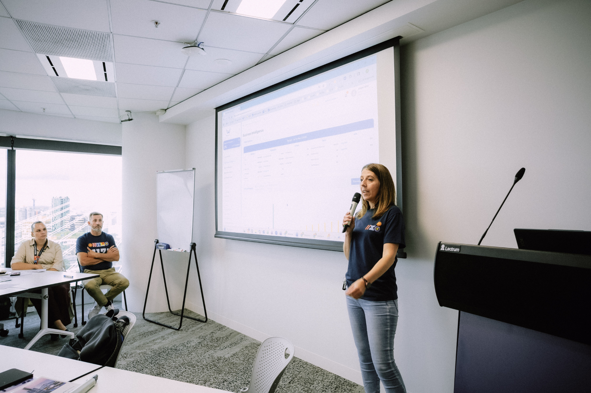 Speaker presenting business intelligence dashboard concepts to the workshop room