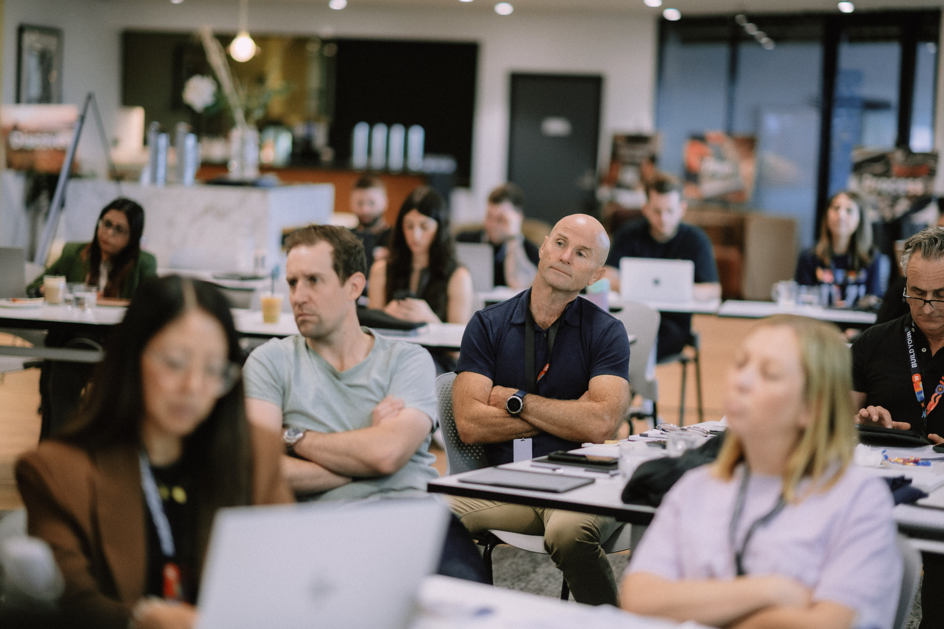 Attendees listening across the workshop room during the Day 1 session