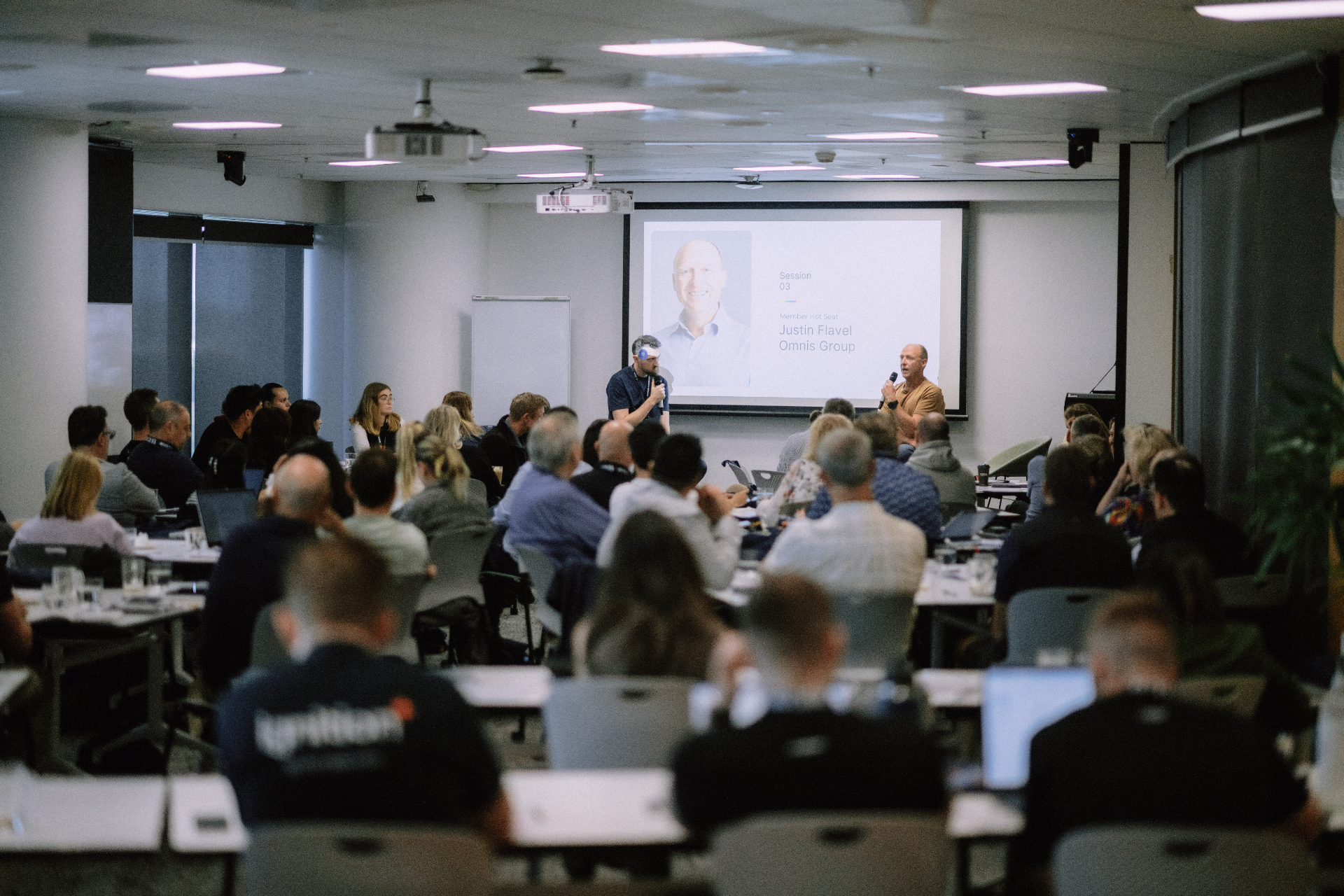 Wide view of the May 25 Day 1 presentation and audience