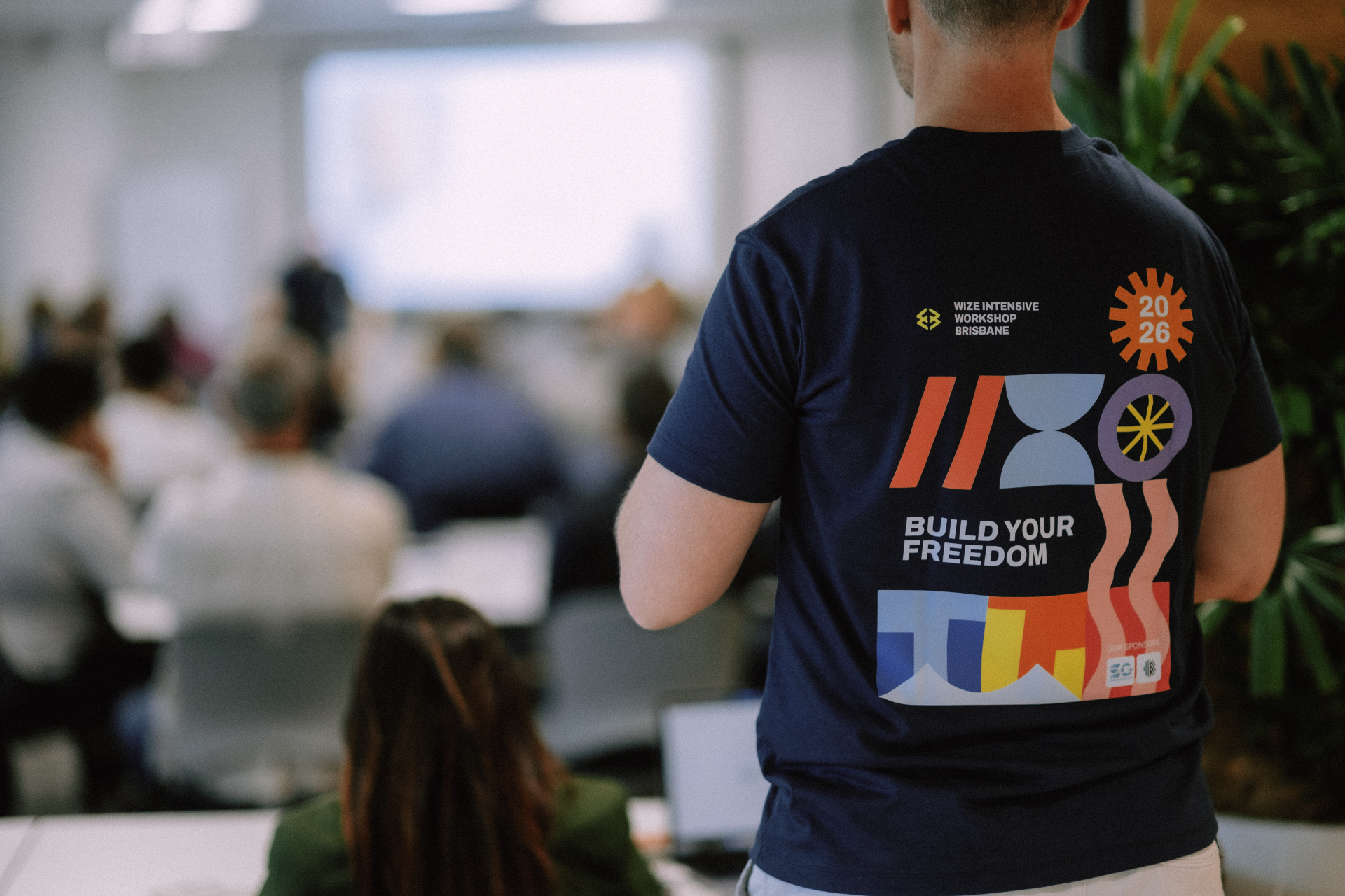Back view of a Wize team member shirt during the Day 1 session
