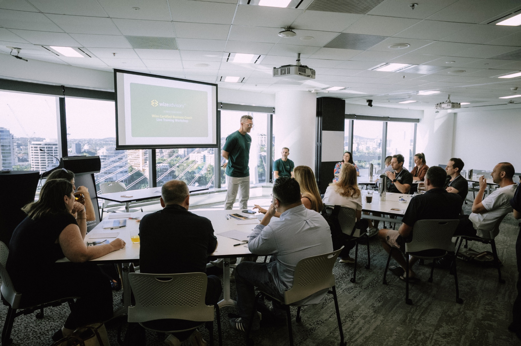 A WizeAdvisory coach leading a live workshop