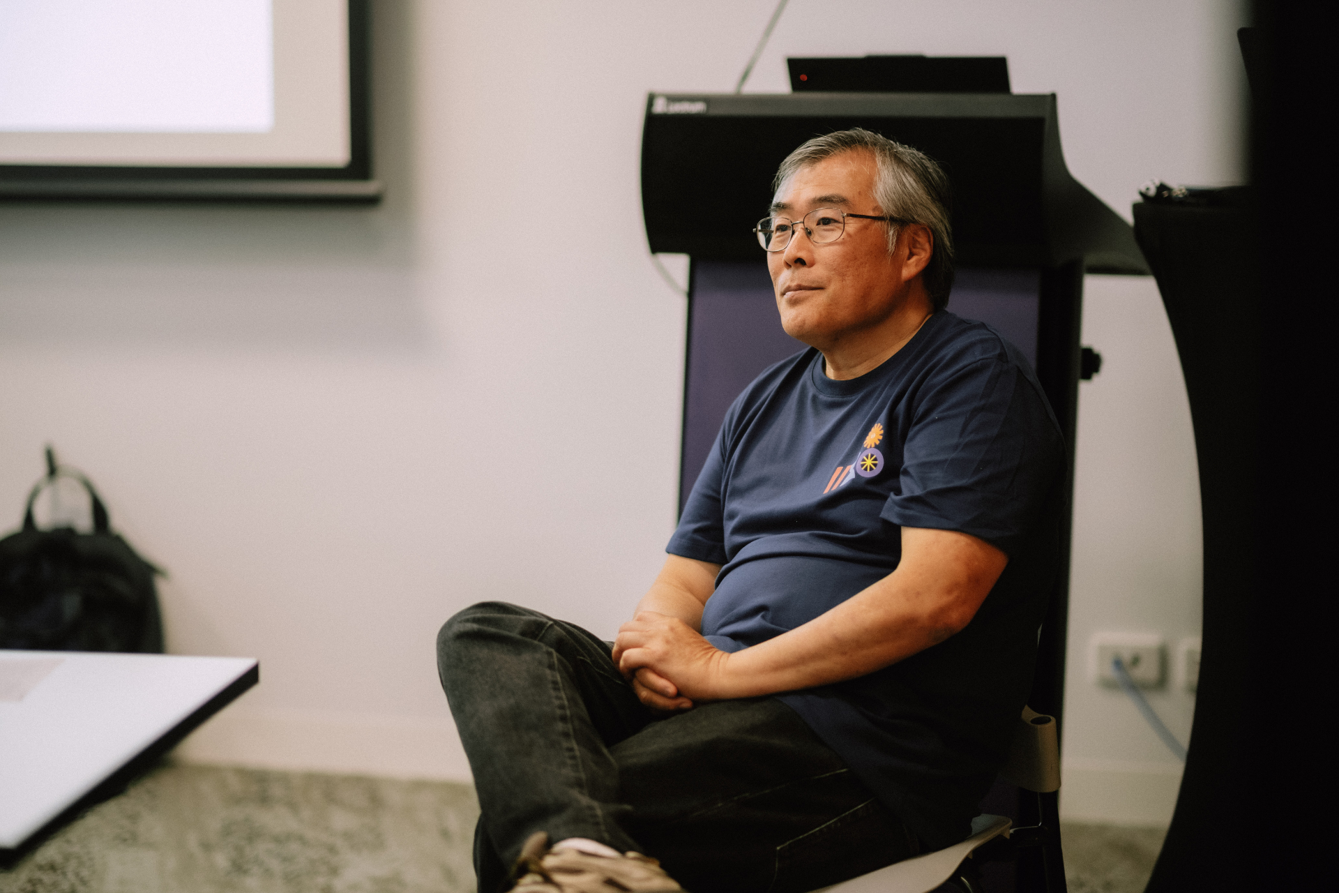 Attendee seated and listening attentively during the Day 4 Wize Intensive